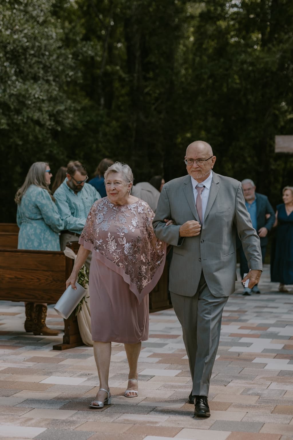 Wedding guests walking down the aisle after an outdoor ceremony